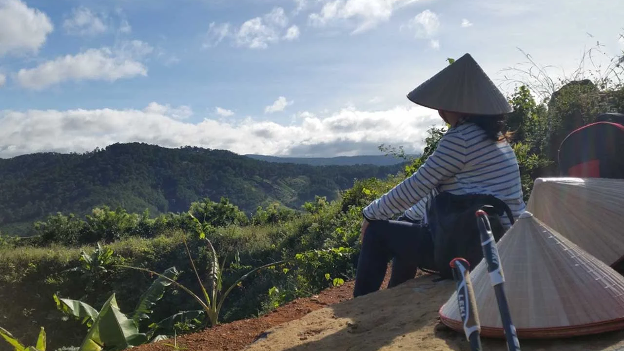Vietnam Detox guest sitting at a mountain viewpoint