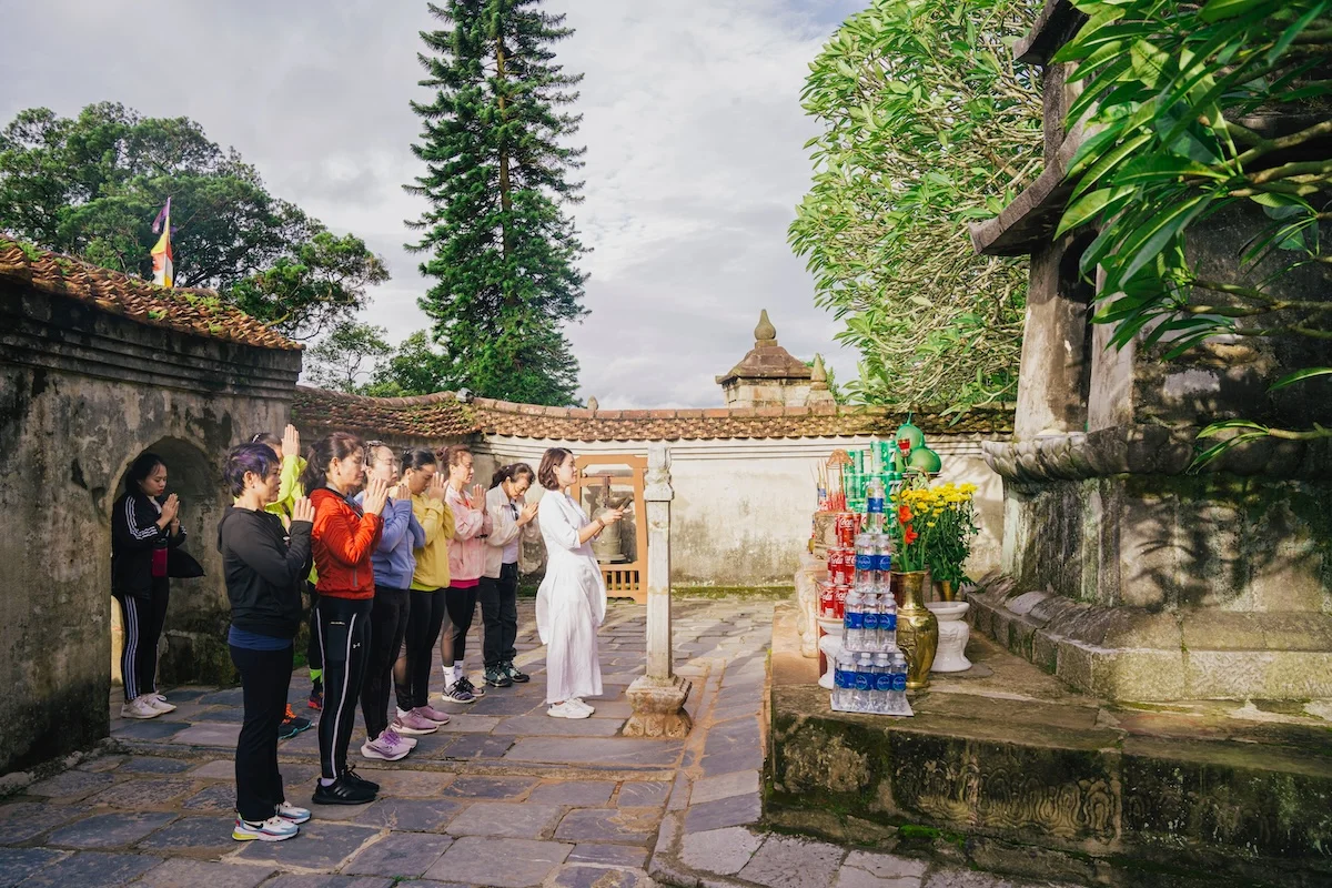 Contemplative mountain walk near a stupa in Yên Tử