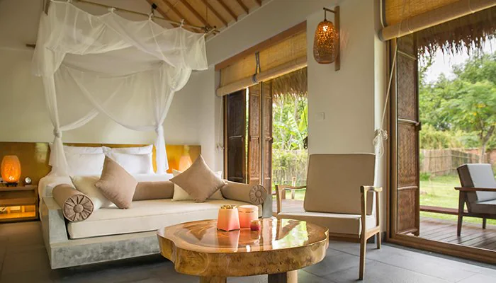 Bungalow lounge and bedroom at Alba Wellness Valley Hue for the Yên Retreat