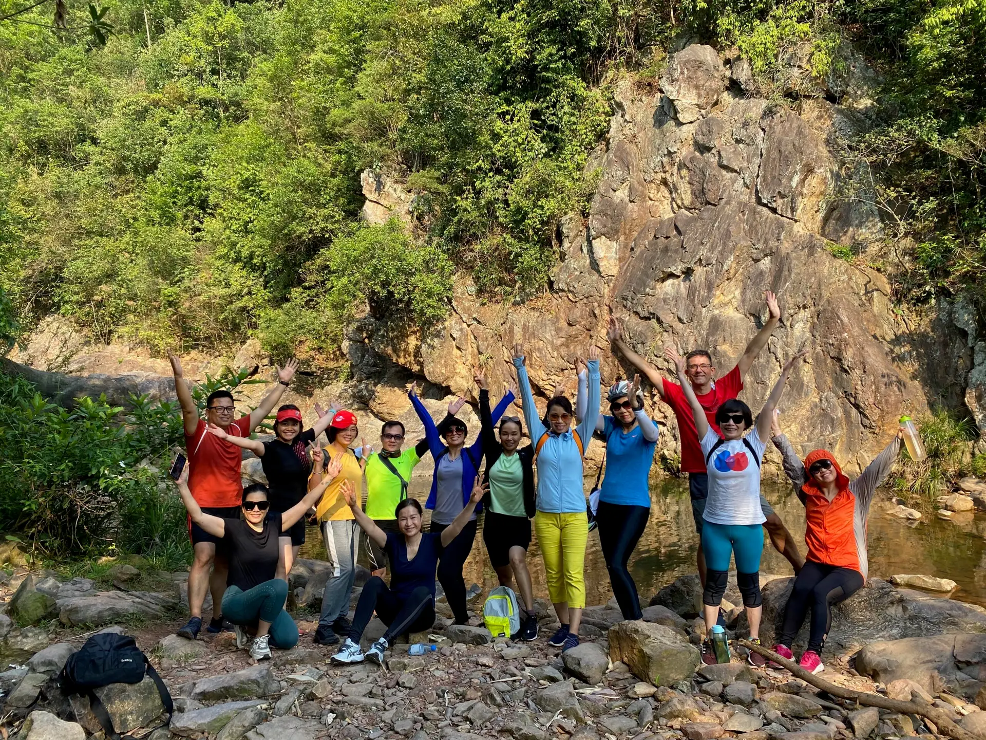 Guests celebrating together after a morning stream walk at Alba Wellness Valley Hue