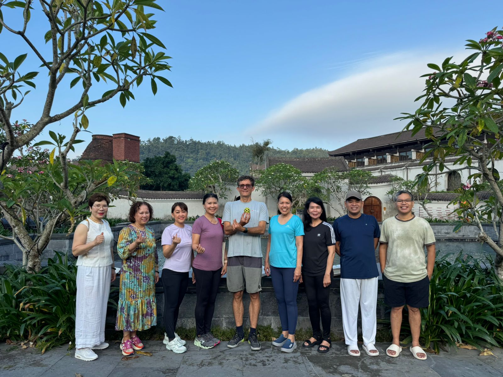 An Retreat guests connecting in a Legacy Yên Tử courtyard